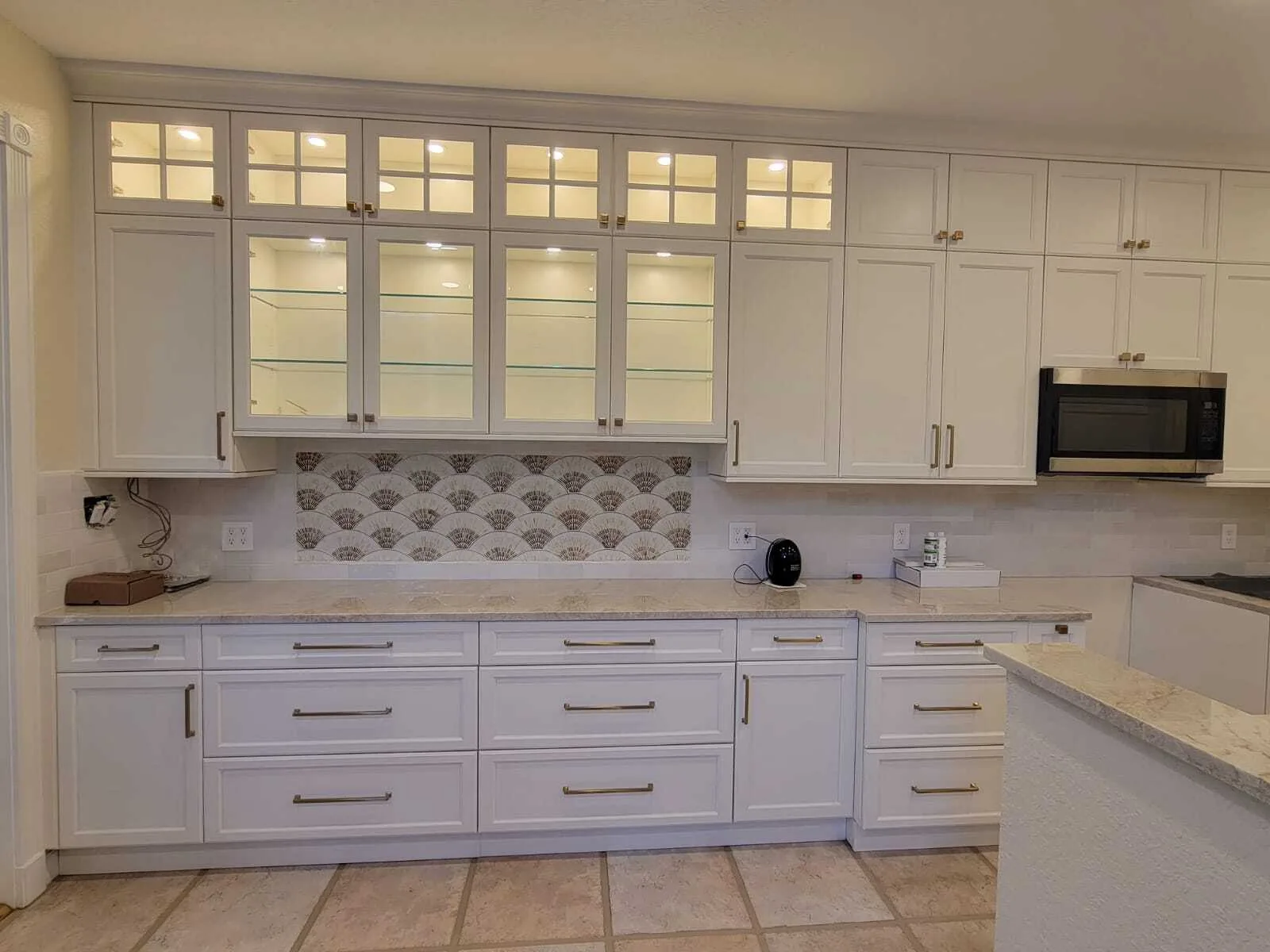 Modern white kitchen remodel with painted cabinets and quartz counters by AP Interior Solutions